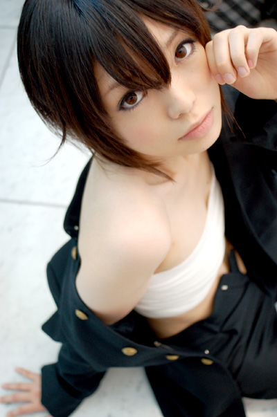 namada, inuzuka koushi, sumomomo momomo, photo (medium), 1girl, androgynous, arm support, asian, blurry, breast bind, breasts, brown eyes, brown hair, chest wrap, cosplay, depth of field, female focus, gakuran, inuzuka koushi (cosplay), jacket, looking at viewer, midriff, no shirt, off shoulder, on floor, on ground, open clothes, open jacket, reverse trap, sarashi, school uniform, short hair, sitting, small breasts, solo, unbuttoned