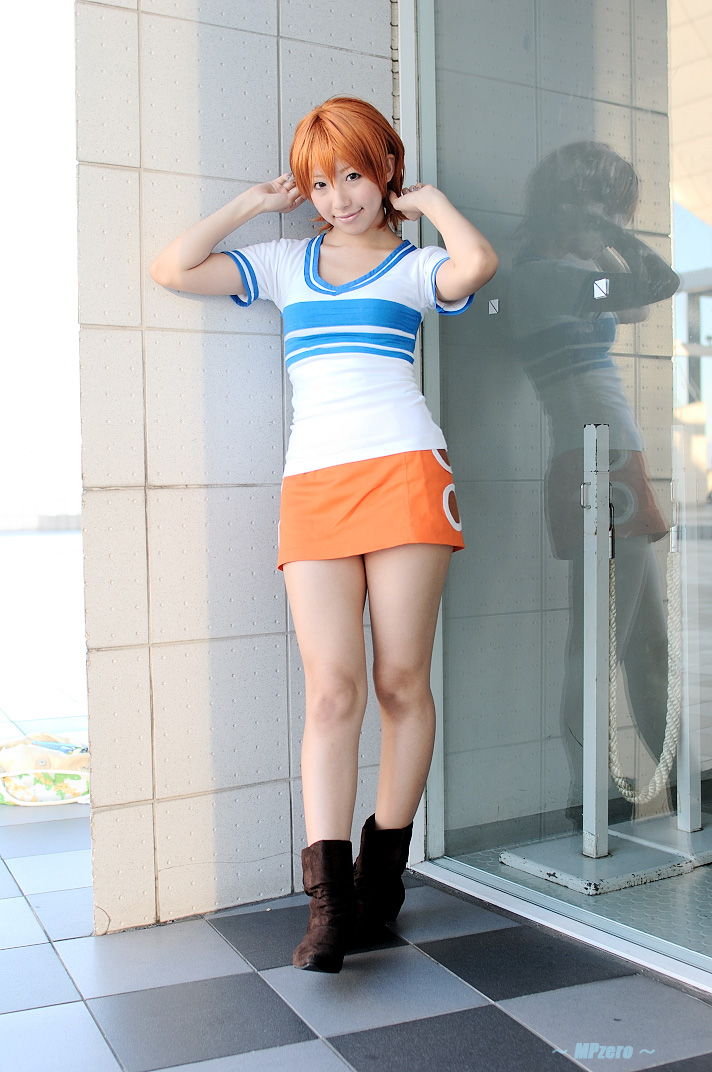 nami (one piece), nami (one piece) (east blue), one piece, real life, cosplay photo, photo (medium), 1girl, asian, boots, checkered floor, cosplay, female focus, floor, full body, miniskirt, nami (one piece) (cosplay), orange hair, pencil skirt, reflection, shiriru, shirt, skirt, solo, standing, striped clothes, striped shirt, t-shirt, thighs