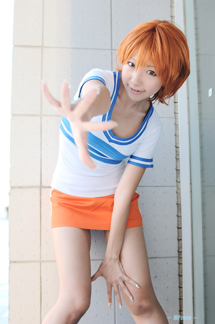 nami (one piece), nami (one piece) (east blue), one piece, real life, photo (medium), 1girl, asian, cosplay, feet out of frame, female focus, miniskirt, nami (one piece) (cosplay), orange hair, shiriru, shirt, skirt, solo, standing, striped clothes, striped shirt, t-shirt