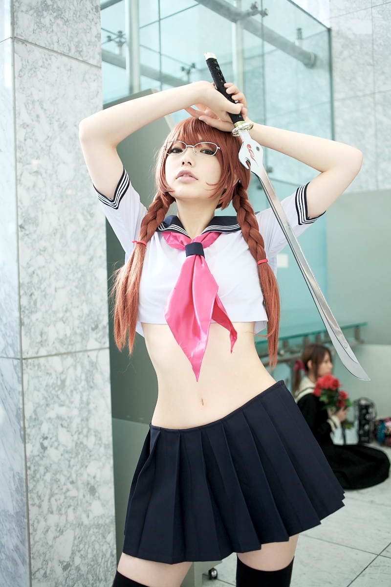 namada, arisugawa shii, the art of yamashita shunya, black legwear, highres, photo (medium), 2girls, aqua eyes, arisugawa shii (cosplay), asian, blue eyes, blurry, braid, brown hair, color contacts, contrapposto, cosplay, crop top, depth of field, glasses, green eyes, lensless glasses, long hair, looking at viewer, midriff, miniskirt, multiple girls, navel, pleated skirt, sailor, school uniform, serafuku, short sleeves, skirt, solo focus, standing, sword, thighhighs, twin braids, weapon, zettai ryouiki