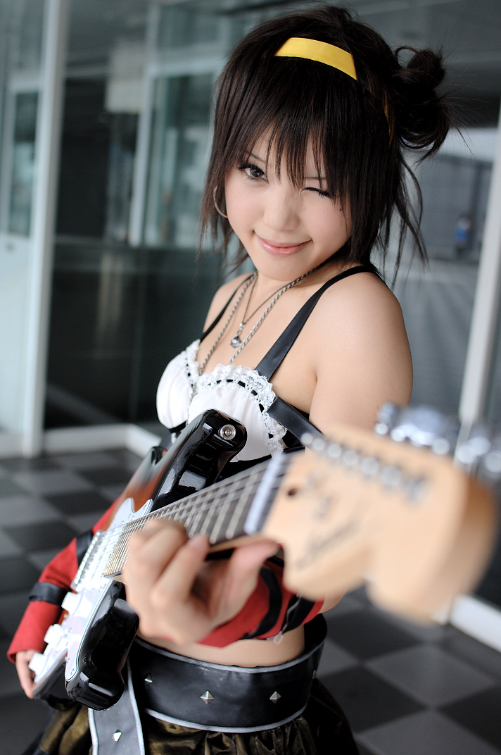 kipi-san, suzumiya haruhi, real life, suzumiya haruhi no yuuutsu, cosplay photo, photo (medium), 1girl, asian, belt, breasts, cosplay, elbow gloves, electric guitar, female focus, fender stratocaster, gloves, guitar, hairband, indoors, instrument, looking at viewer, midriff, one eye closed, small breasts, solo, suzumiya haruhi (cosplay), wink