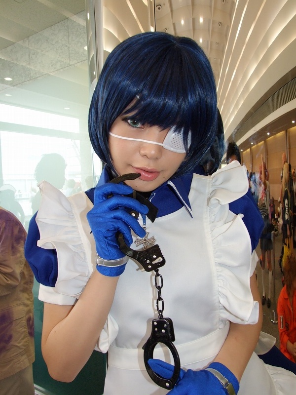 namada, ryomou shimei, ikkitousen, photo (medium), 1girl, apron, asian, blue eyes, blue gloves, blue hair, collar, color contacts, contrapposto, cosplay, cross, cuffs, eyepatch, female focus, gloves, handcuffs, looking at viewer, maid, maid apron, puffy short sleeves, puffy sleeves, ryomou shimei (cosplay), short sleeves, solo, standing