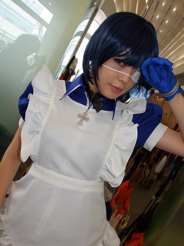 namada, ryomou shimei, ikkitousen, photo (medium), 1girl, apron, asian, blue eyes, blue gloves, blue hair, collar, color contacts, contrapposto, cosplay, cross, dutch angle, eyepatch, female focus, gloves, indoors, japanese (nationality), looking at viewer, maid, maid apron, puffy short sleeves, puffy sleeves, reflection, ryomou shimei (cosplay), short sleeves, solo, standing