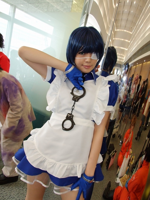 namada, ryomou shimei, ikkitousen, photo (medium), 1girl, apron, asian, blue eyes, blue gloves, blue hair, collar, color contacts, contrapposto, cosplay, cross, cuffs, dutch angle, eyepatch, gloves, handcuffs, indoors, looking at viewer, maid, maid apron, puffy short sleeves, puffy sleeves, reflection, ryomou shimei (cosplay), short sleeves, solo focus, standing