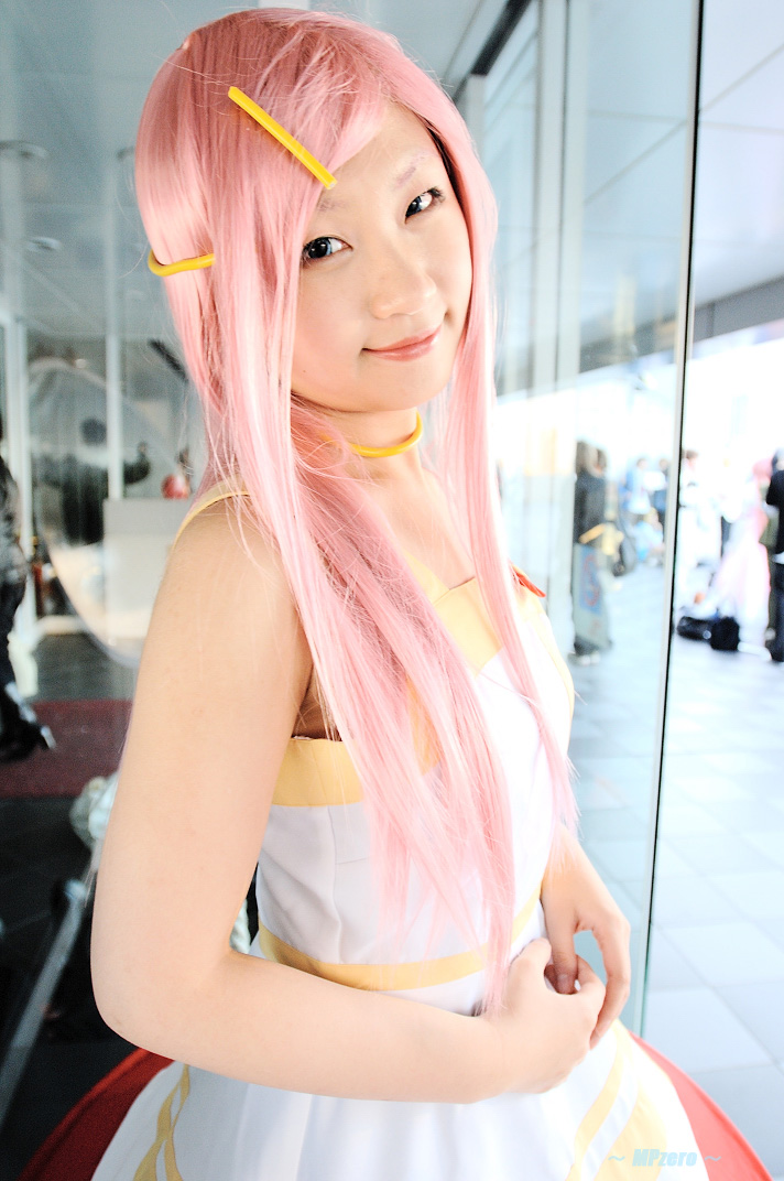 takamura mashiro, anemone (eureka seven), eureka seven, eureka seven (series), photo (medium), 1girl, anemone (eureka seven) (cosplay), asian, blue eyes, color contacts, cosplay, dress, female focus, hair ornament, hairclip, indoors, long hair, looking at viewer, pink hair, solo
