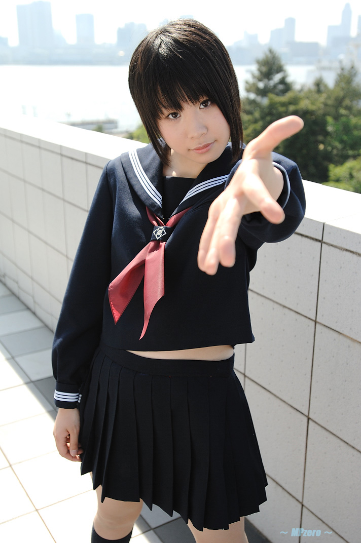 touta miya, photo (medium), 1girl, asian, checkered floor, cosplay, female focus, japanese (nationality), kneehighs, looking at viewer, midriff peek, outdoors, outstretched arm, pleated skirt, school uniform, serafuku, short hair, skirt, socks, solo, tile wall, tiles
