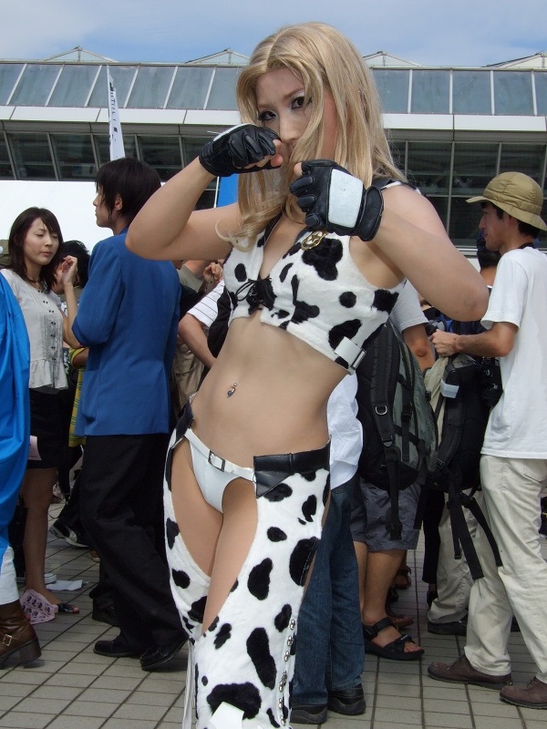 dixie clemets, rumble roses, photo (medium), bikini, bikini bottom only, bikini top only, chaps, cosplay, cow print, fingerless gloves, gloves, swimsuit