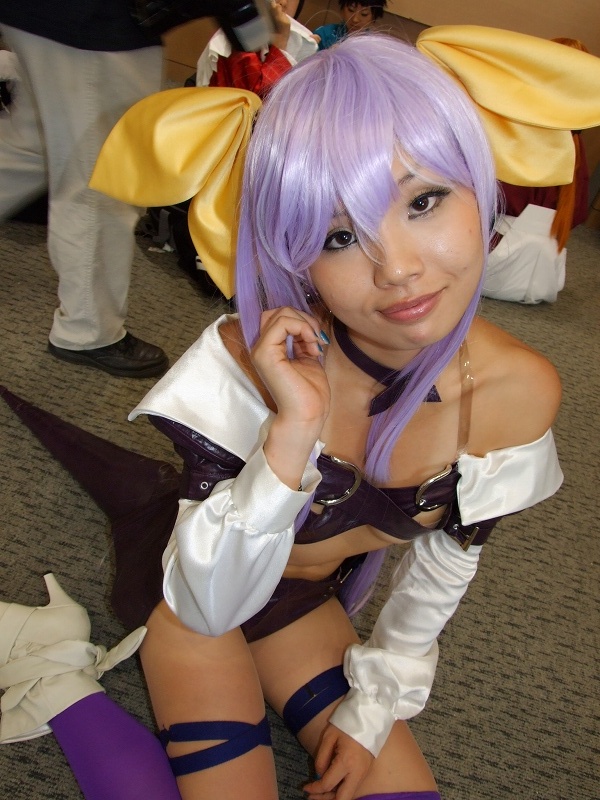 dizzy (guilty gear), arc system works, guilty gear, photo (medium), belt bra, bow, breasts, cosplay, dress, hair bow, onihara akira, open clothes, open dress, purple hair, thighhighs, underboob