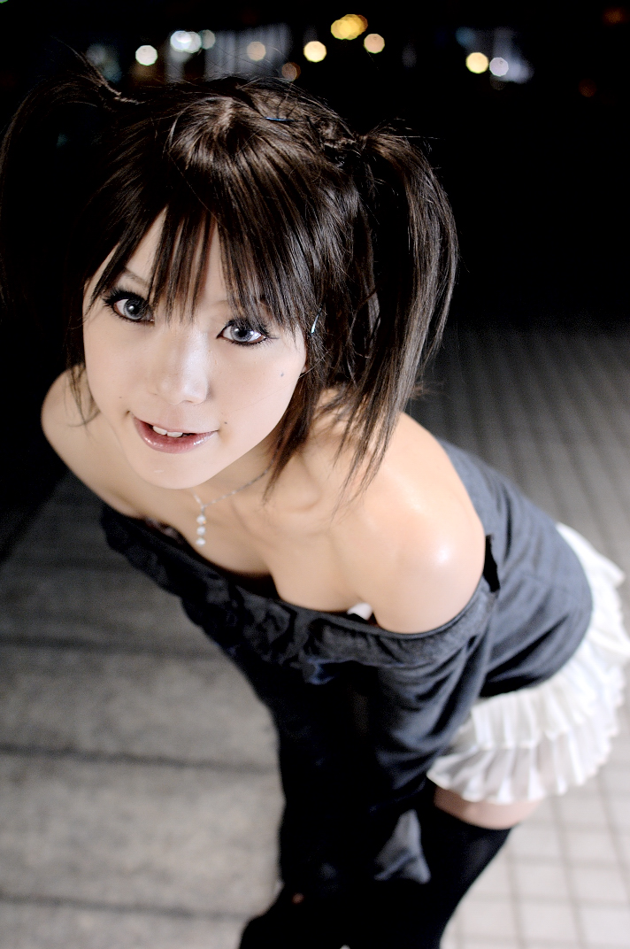 kipi-san, photo (medium), 1girl, asian, bare shoulders, black thighhighs, blue eyes, breasts, brown hair, cleavage, color contacts, female focus, grey eyes, jewelry, leaning forward, looking at viewer, miniskirt, mole, outdoors, pendant, skirt, small breasts, solo, thighhighs, twintails, zettai ryouiki