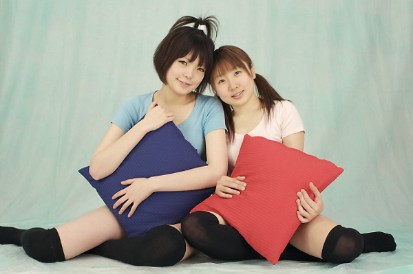 miasa, namada, black legwear, striped, photo (medium), 2girls, asian, black hair, brown eyes, brown hair, facing viewer, full body, indoors, japanese (nationality), long hair, looking at viewer, multiple girls, no shoes, pillow, shirt, short hair, sitting, smile, t-shirt, thighhighs, twintails, yokozuwari