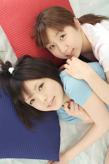 miasa, namada, photo (medium), 2girls, asian, black hair, brown eyes, brown hair, long hair, looking at viewer, multiple girls, pillow, shirt, short hair, smile, t-shirt, twintails