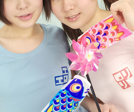 miasa, namada, black legwear, lowres, photo (medium), translated, 2girls, asian, black hair, brown eyes, brown hair, clothes writing, color contacts, indoors, long hair, looking at viewer, multiple girls, no shoes, pinwheel, shirt, short hair, t-shirt, thighhighs, twintails