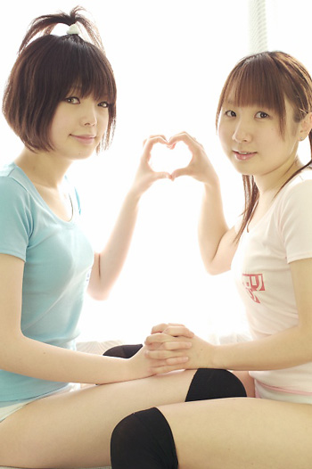 miasa, namada, black legwear, photo (medium), translated, 2girls, asian, black hair, brown eyes, brown hair, clothes writing, color contacts, heart, heart hands, heart hands duo, indoors, interlocked fingers, long hair, looking at viewer, multiple girls, panties, shirt, short hair, striped clothes, striped panties, t-shirt, thighhighs, twintails, underwear