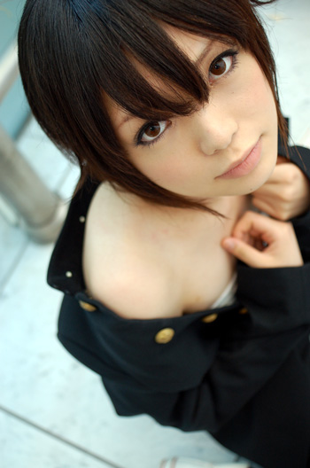 namada, inuzuka koushi, sumomomo momomo, photo (medium), 1girl, androgynous, arm support, asian, blurry, breast bind, breasts, brown eyes, brown hair, chest wrap, cosplay, depth of field, female focus, gakuran, inuzuka koushi (cosplay), jacket, looking at viewer, no shirt, off shoulder, on floor, on ground, open clothes, reverse trap, sarashi, school uniform, short hair, sitting, small breasts, solo, unbuttoned