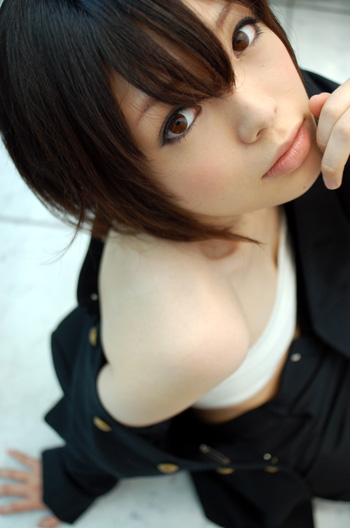 namada, inuzuka koushi, sumomomo momomo, photo (medium), 1girl, arm support, asian, blurry, breast bind, breasts, brown eyes, brown hair, chest wrap, coat, cosplay, depth of field, female focus, from above, gakuran, inuzuka koushi (cosplay), looking at viewer, no shirt, off shoulder, on floor, on ground, open clothes, sarashi, school uniform, short hair, sitting, small breasts, solo, unbuttoned