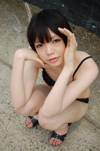 namada, photo (medium), tagme, 1girl, asian, bikini, black bikini, black hair, black sandals, breasts, female focus, from above, full body, looking at viewer, mole, outdoors, sandals, short hair, small breasts, solo, squatting, swimsuit