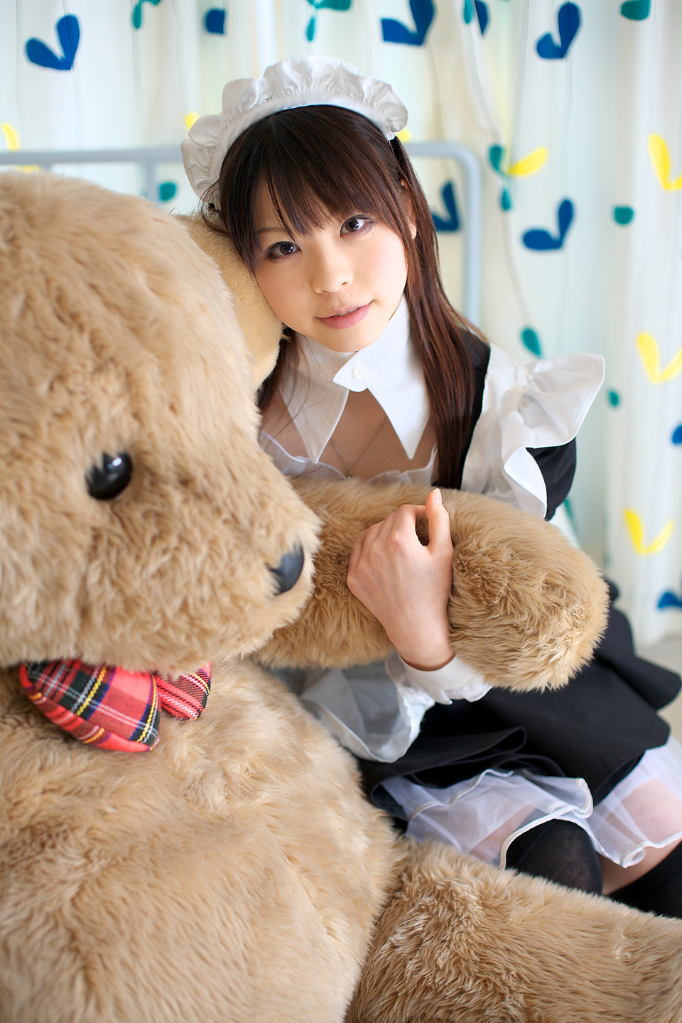 katou mari, highres, photo (medium), apron, cosplay, maid, maid apron, stuffed animal, stuffed toy, teddy bear, thighhighs