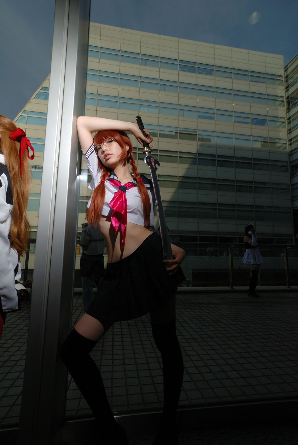 namada, arisugawa shii, the art of yamashita shunya, black legwear, highres, photo (medium), 3girls, aqua eyes, arisugawa shii (cosplay), asian, blue eyes, blurry, braid, brown hair, color contacts, cosplay, crop top, depth of field, elbow gloves, glasses, gloves, green eyes, lensless glasses, long hair, looking at viewer, maid, maid headdress, midriff, miniskirt, multiple girls, pleated skirt, sailor, school uniform, serafuku, short sleeves, skirt, solo focus, standing, sword, thighhighs, twin braids, weapon, zettai ryouiki