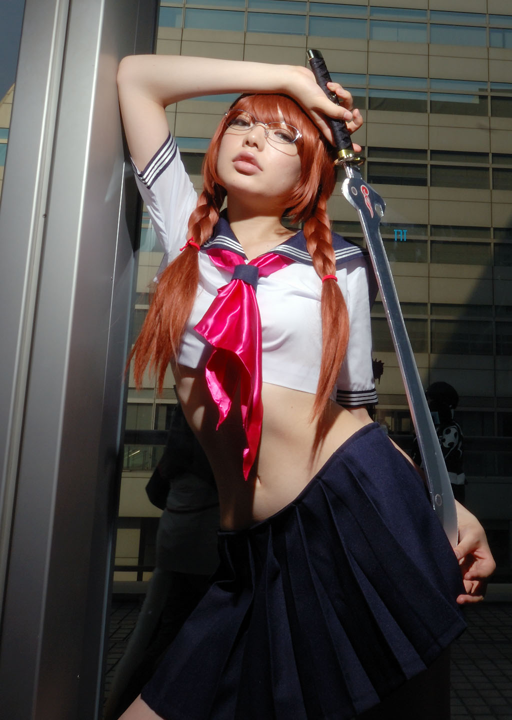 namada, arisugawa shii, the art of yamashita shunya, highres, photo (medium), 1girl, aqua eyes, arisugawa shii (cosplay), asian, blue eyes, blurry, braid, brown hair, color contacts, cosplay, crop top, depth of field, female focus, glasses, green eyes, lensless glasses, long hair, looking at viewer, midriff, miniskirt, navel, pleated skirt, sailor, school uniform, serafuku, short sleeves, skirt, solo, standing, sword, thighhighs, twin braids, weapon
