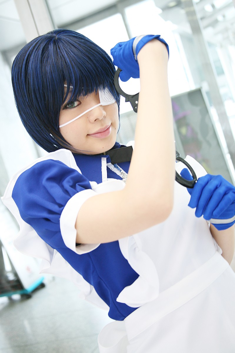 namada, ryomou shimei, ikkitousen, highres, photo (medium), 1girl, apron, asian, blue eyes, blue gloves, blue hair, collar, color contacts, cosplay, cross, cuffs, dutch angle, eyepatch, female focus, gloves, handcuffs, indoors, looking at viewer, maid, maid apron, puffy short sleeves, puffy sleeves, ryomou shimei (cosplay), short sleeves, solo, standing