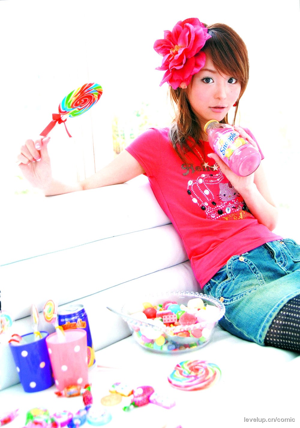 hirano aya, hello kitty, sanrio, fishnet legwear, highres, photo (medium), denim, denim skirt, fishnets, flower, shirt, skirt, t-shirt