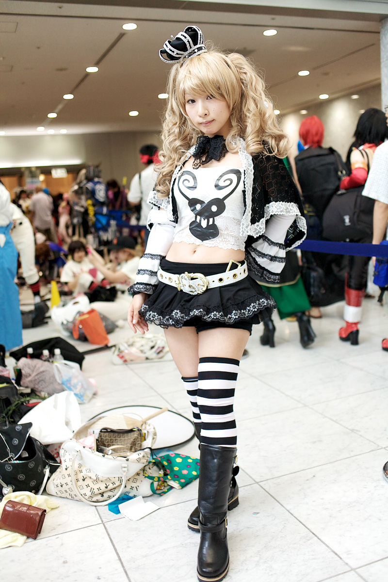 perona, one piece, black footwear, red footwear, highres, photo (medium), 1girl, belt, blonde hair, boots, bow, camisole, cosplay, crown, frills, full body, jolly roger, lace, perona (cosplay), red hair, shoes, short cape, standing, striped clothes, striped thighhighs, thighhighs, thriller bark, white belt, yoshikawa sunao