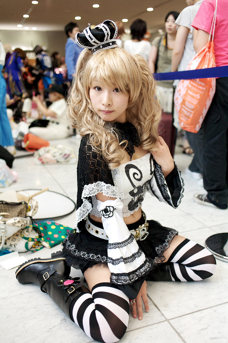 perona, one piece, black footwear, highres, photo (medium), 1girl, belt, blonde hair, boots, bow, camisole, capelet, cosplay, crown, frills, jolly roger, lace, patterned legwear, perona (cosplay), shoes, short cape, skirt, striped clothes, striped thighhighs, thighhighs, thriller bark, twintails, white belt, yoshikawa sunao