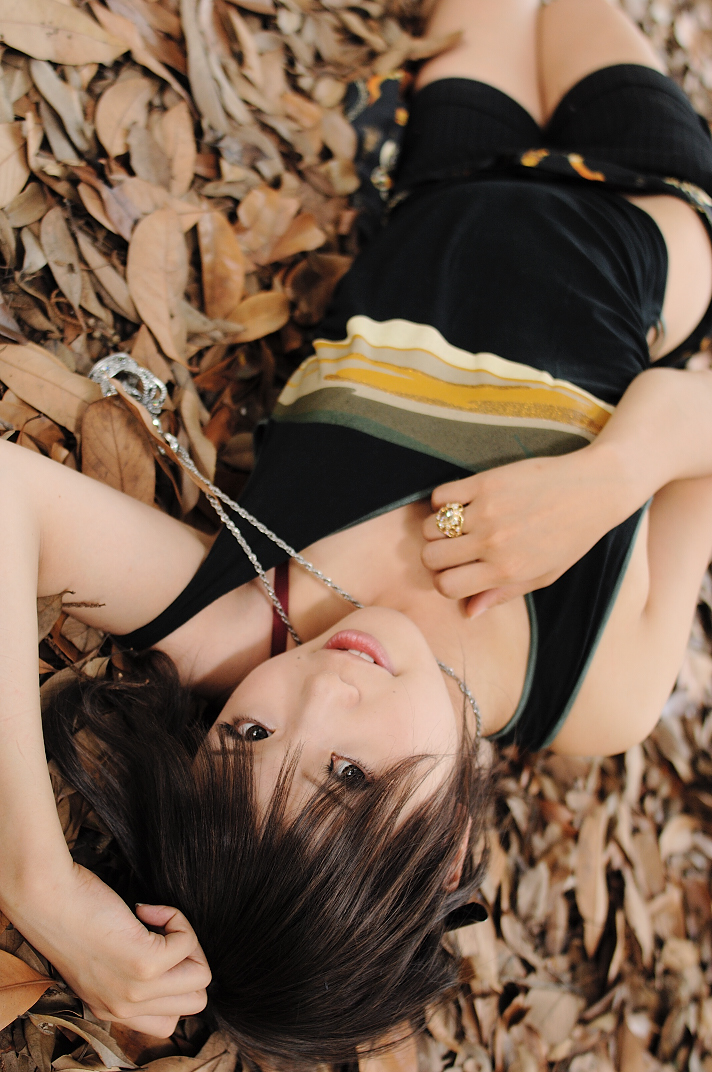 kipi-san, photo (medium), tagme, 1girl, asian, bling, blurry, bra, breasts, brown eyes, brown hair, depth of field, female focus, jewelry, leaf, looking at viewer, lying, on floor, on ground, outdoors, pendant, ring, short hair, shorts, small breasts, solo, strap slip, tank top, underwear