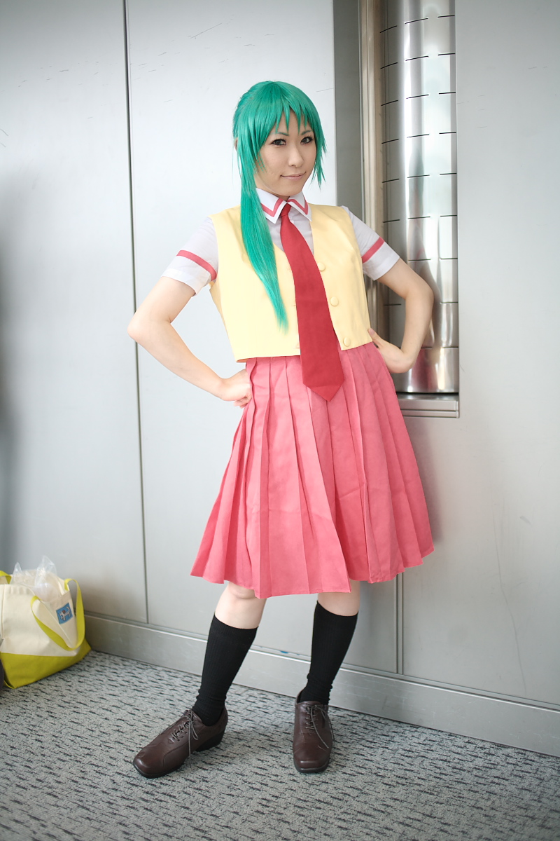 chippi, sonozaki mion, higurashi no naku koro ni, highres, photo (medium), 1girl, asian, cosplay, female focus, green hair, hands on own hips, indoors, long hair, looking at viewer, necktie, school uniform, shoes, socks, solo, sonozaki mion (cosplay), vest