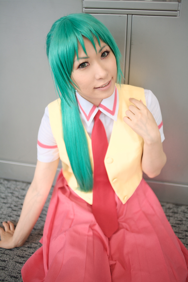 chippi, sonozaki mion, higurashi no naku koro ni, highres, photo (medium), 1girl, arm support, asian, color contacts, cosplay, female focus, green eyes, green hair, indoors, long hair, looking at viewer, matching hair/eyes, necktie, on floor, school uniform, sitting, solo, sonozaki mion (cosplay), vest