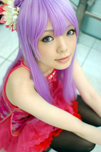 namada, character request, copyright request, photo (medium), 1girl, asian, bare shoulders, black thighhighs, blurry, breasts, china dress, chinese clothes, color contacts, cosplay, depth of field, dress, eyeliner, female focus, flower, frilled skirt, frills, garter belt, garter straps, hair flower, hair ornament, indoors, long hair, looking at viewer, makeup, miniskirt, mole, parted lips, pink dress, pink skirt, purple eyes, purple hair, skirt, small breasts, solo, squatting, thighhighs
