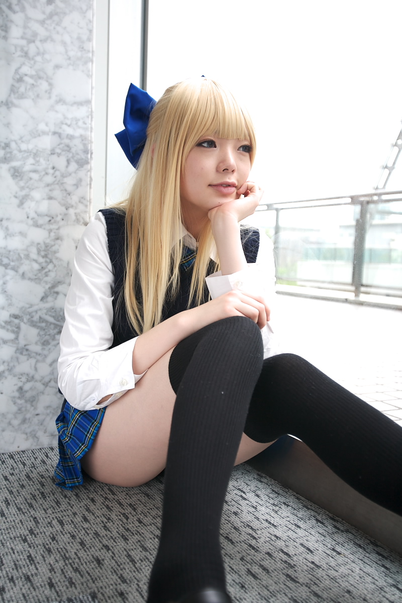 namada, looking away, character request, highres, photo (medium), 1girl, asian, black thighhighs, blonde hair, blue eyes, blue ribbon, blurry, bow, breasts, color contacts, cosplay, depth of field, dress shirt, female focus, hair bow, head rest, indoors, miniskirt, necktie, on floor, plaid clothes, plaid skirt, pleated skirt, ribbon, rug, school uniform, shirt, sitting, skirt, small breasts, solo, sweater vest, thighhighs, white shirt, window, zettai ryouiki