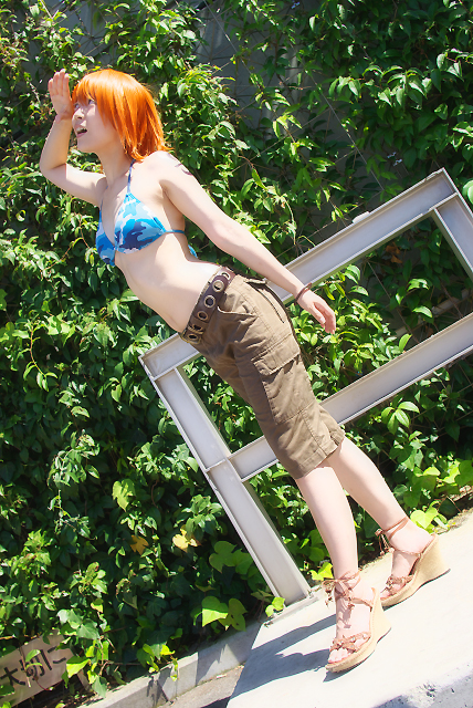 amanone shun, nami (one piece), nami (one piece) (skypiea), one piece, real life, photo (medium), 1girl, asian, bikini, bikini top only, camouflage, cargo shorts, cosplay, female focus, nami (one piece) (cosplay), orange hair, outdoors, plant, sandals, shorts, skypiea, solo, swimsuit, wedge heels