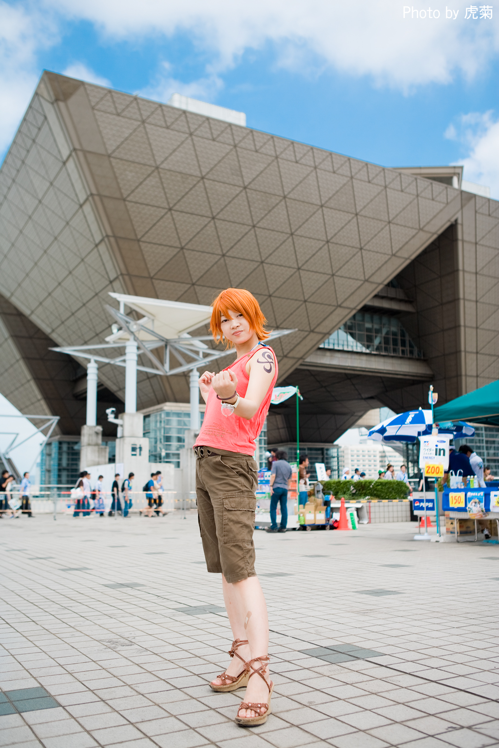 amanone shun, nami (one piece), nami (one piece) (skypiea), one piece, pepsi, highres, photo (medium), 1girl, asian, bandaid, bare shoulders, belt, bottle, bracelet, building, cargo shorts, clenched hand, cosplay, feet, female focus, full body, jewelry, market stall, nami (one piece) (cosplay), orange hair, outdoors, sandals, shorts, standing, table, tank top, tattoo, umbrella, wedge heels