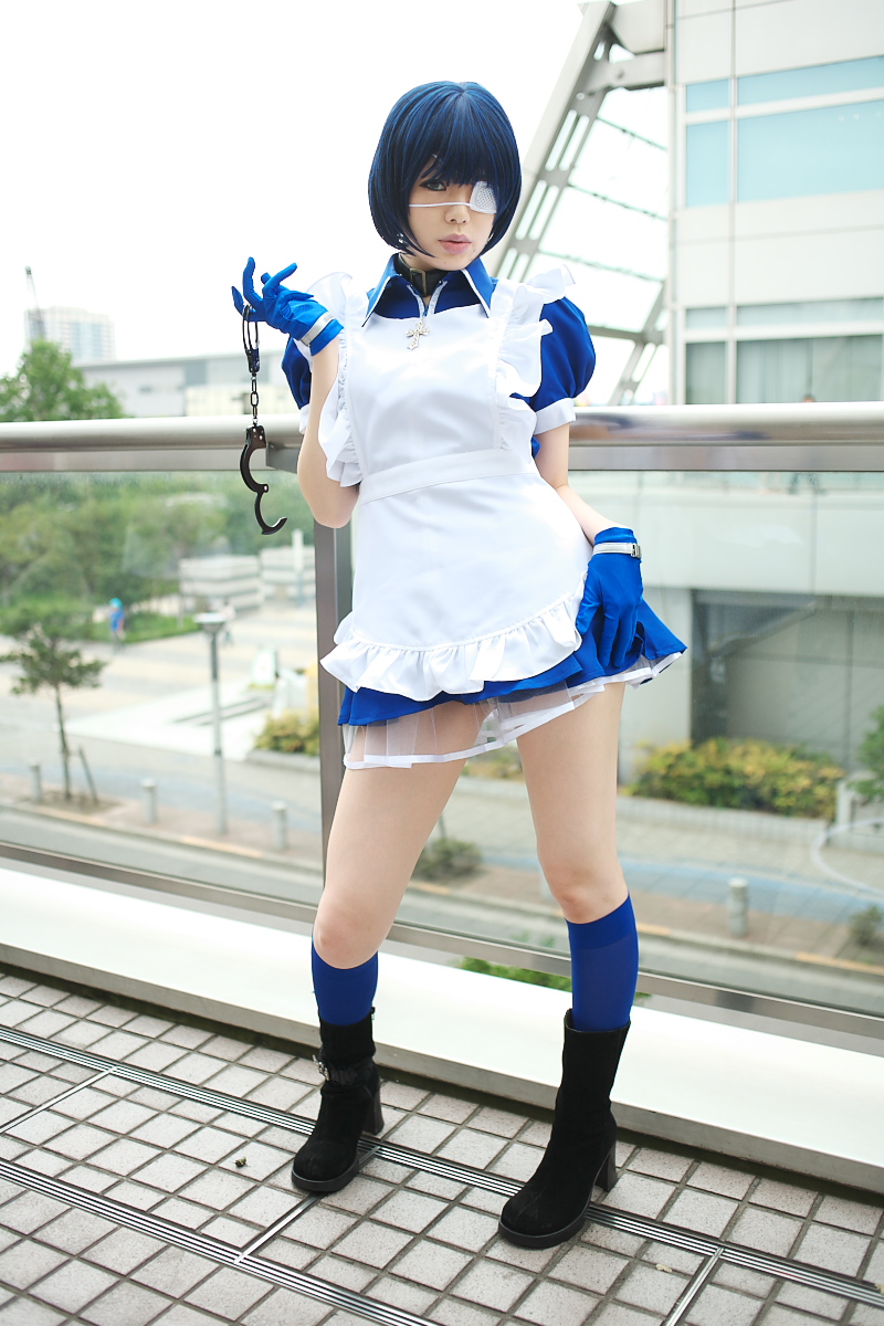 namada, ryomou shimei, ikkitousen, highres, photo (medium), 1girl, apron, asian, black boots, blue eyes, blue gloves, blue hair, blue socks, boots, collar, color contacts, contrapposto, cosplay, cross, cuffs, eyepatch, female focus, full body, gloves, handcuffs, high heels, kneehighs, looking at viewer, maid, maid apron, outdoors, puffy short sleeves, puffy sleeves, ryomou shimei (cosplay), short sleeves, socks, solo, standing