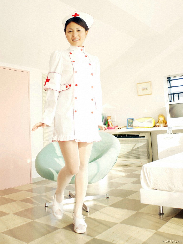 kawamura yuki, white legwear, photo (medium), tagme, 1girl, asian, bedroom, breasts, cosplay, female focus, indoors, looking at viewer, medium breasts, nurse, smile, solo, standing