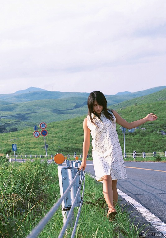 kawamura yuki, photo (medium), tagme, 1girl, asian, bare legs, dress, female focus, guard rail, long hair, outdoors, road sign, sandals, sign, solo, sundress