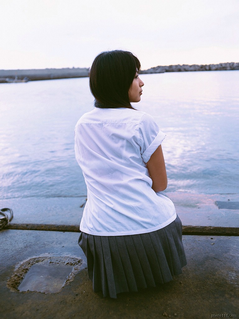 kawamura yuki, photo (medium), tagme, 1girl, asian, cosplay, female focus, long hair, ocean, outdoors, pleated skirt, school uniform, skirt, solo, squatting
