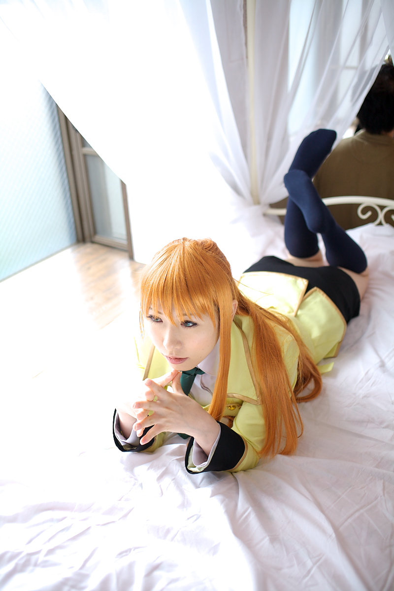 chippi, shirley fenette, code geass, highres, photo (medium), 1girl, asian, bed, bedroom, blazer, blue eyes, color contacts, cosplay, female focus, indoors, jacket, kneehighs, long hair, miniskirt, orange hair, school uniform, shirley fenette (cosplay), skirt, socks, solo