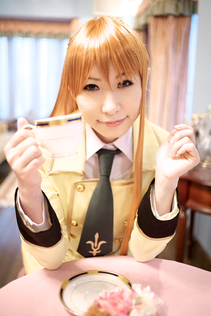 chippi, shirley fenette, code geass, highres, photo (medium), 1girl, asian, blazer, blue eyes, color contacts, cosplay, female focus, indoors, jacket, long hair, looking at viewer, orange hair, school uniform, shirley fenette (cosplay), sitting, solo, tea shop