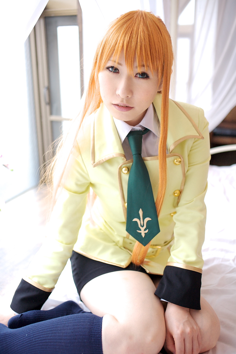 chippi, shirley fenette, code geass, highres, photo (medium), 1girl, asian, bed, bedroom, blazer, blue eyes, color contacts, cosplay, female focus, indoors, jacket, kneehighs, long hair, looking at viewer, miniskirt, orange hair, school uniform, shirley fenette (cosplay), sitting, skirt, socks, solo, yokozuwari