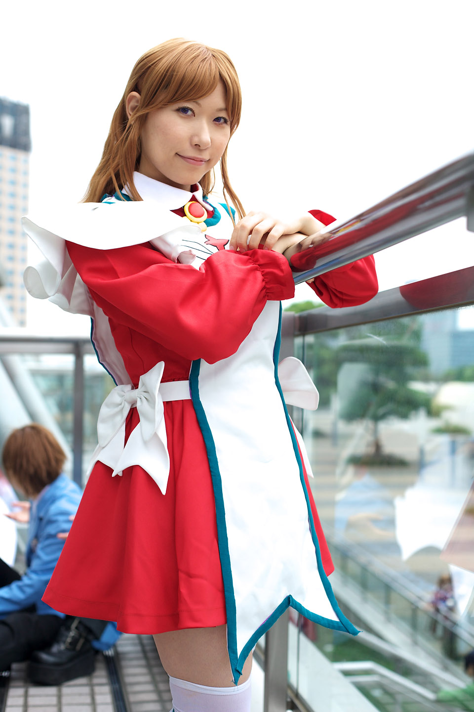 chippi, miya clochette, my-otome, brown footwear, highres, photo (medium), 1girl, apron, asian, blurry, cosplay, depth of field, looking at viewer, maid, maid apron, miya clochette (cosplay), outdoors, school uniform, shoes, short hair, solo focus, thighhighs, white thighhighs, zettai ryouiki