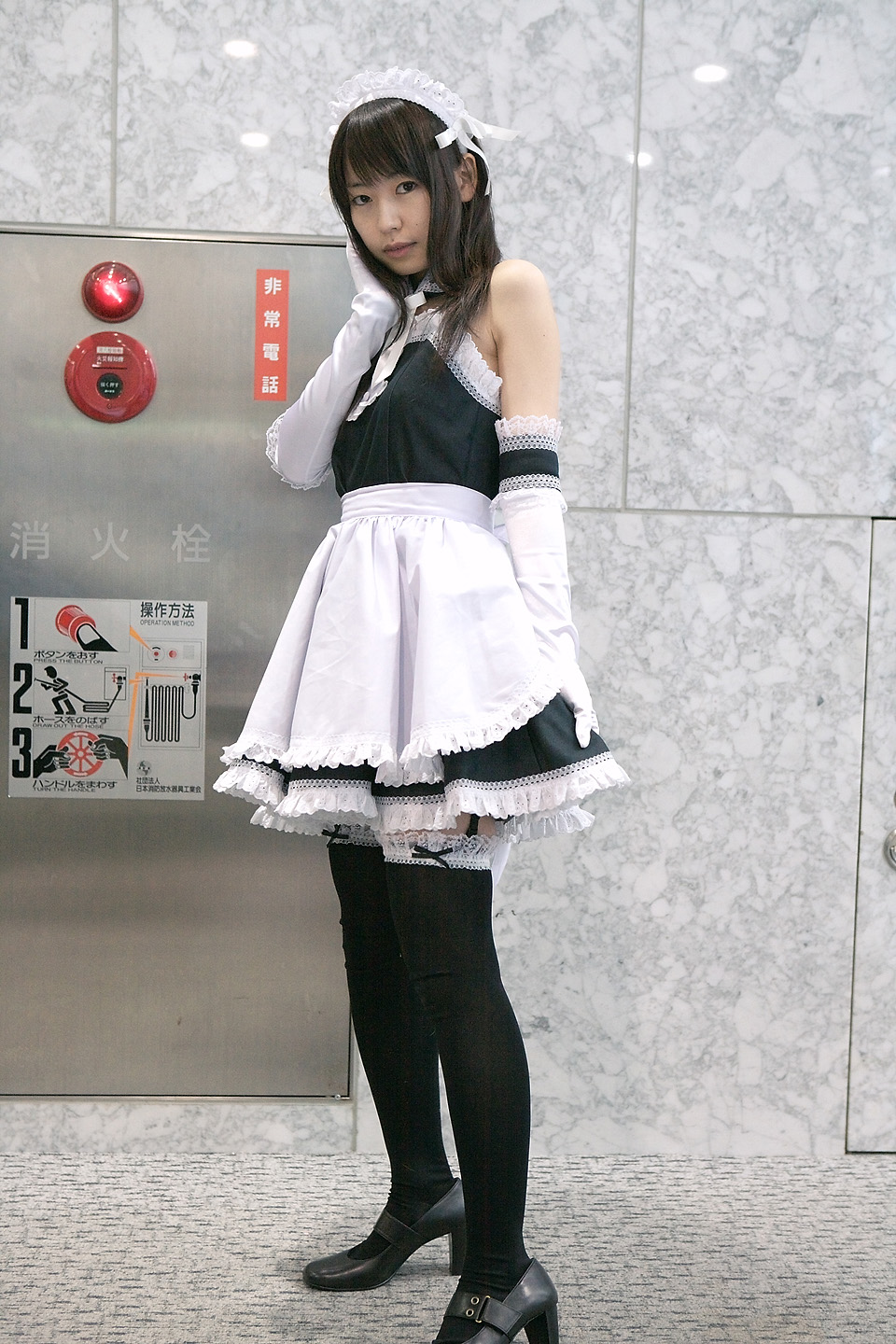 azumo yuiko, kurauchi anna, kore ga watashi no goshujin-sama, black footwear, highres, photo (medium), 1girl, apron, asian, bare shoulders, black thighhighs, blurry, cosplay, depth of field, detached collar, elbow gloves, female focus, gloves, japanese (nationality), looking at viewer, maid, maid apron, maid headdress, nakabayashi yoshitaka's maid uniform, ribbon, solo, standing, thighhighs, white gloves, zettai ryouiki