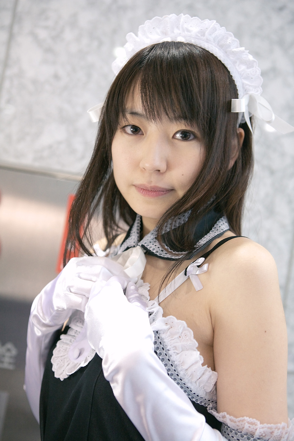 azumo yuiko, kurauchi anna, kore ga watashi no goshujin-sama, highres, photo (medium), 1girl, apron, asian, bare shoulders, blurry, cosplay, depth of field, detached collar, elbow gloves, female focus, gloves, japanese (nationality), looking at viewer, maid, maid apron, maid headdress, nakabayashi yoshitaka's maid uniform, ribbon, solo, white gloves