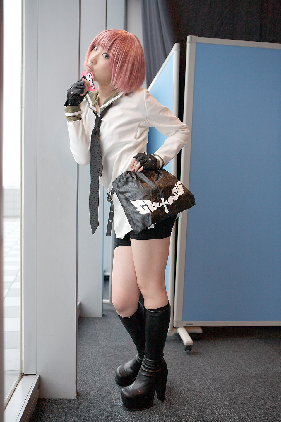 kurosaki shihomu, simca, air gear, platform footwear, highres, photo (medium), belt, bike shorts, boots, cosplay, fingerless gloves, gloves, hand on own hip, high heel boots, high heels, knee boots, looking at viewer, necktie, pink hair, platform heels, sailor, school uniform, serafuku, short hair