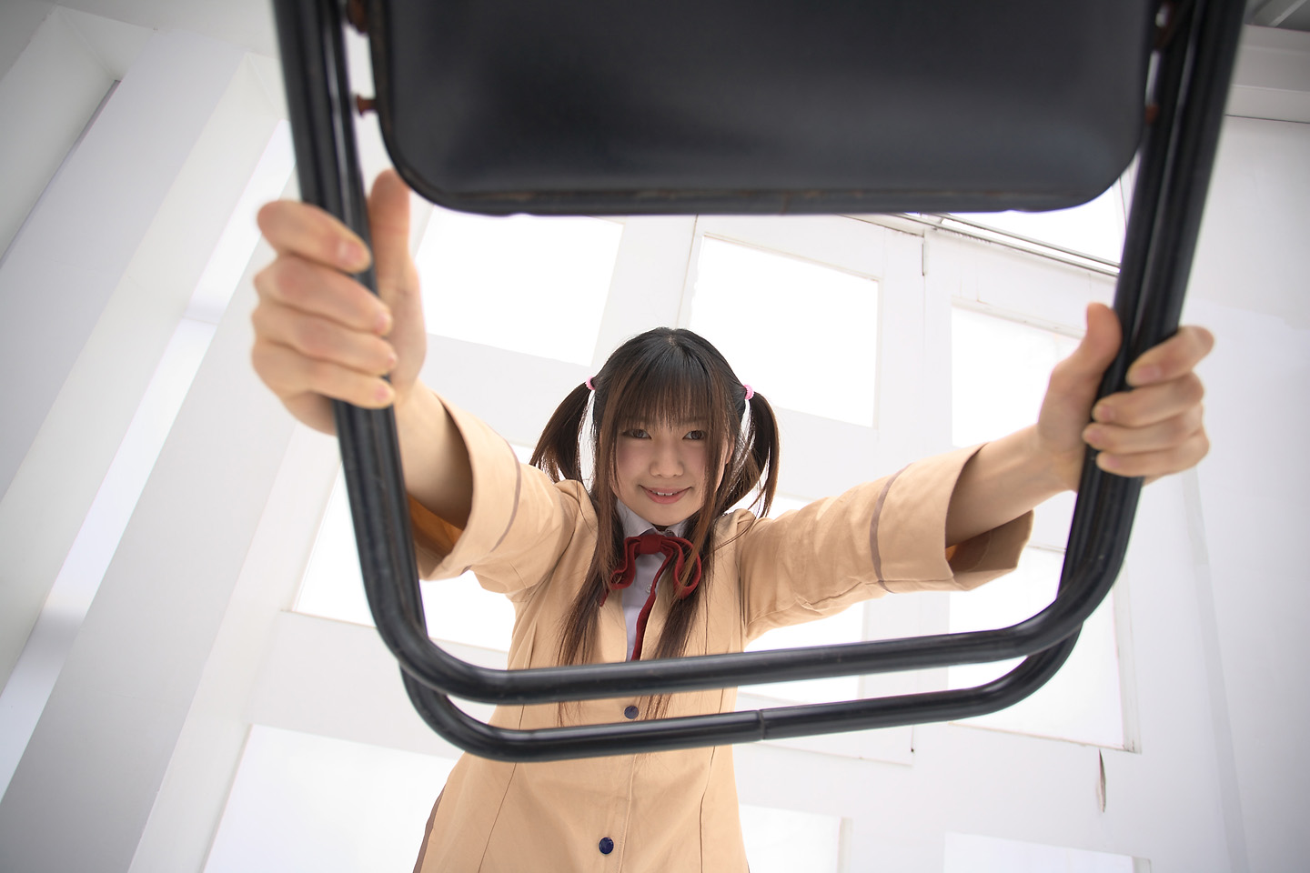 sakura yayoi, tsukamoto tenma, school rumble, photo (medium), 1girl, asian, blazer, brown hair, chair, cosplay, female focus, jacket, long hair, looking at viewer, school uniform, skirt, solo, twin ahoge, two side up
