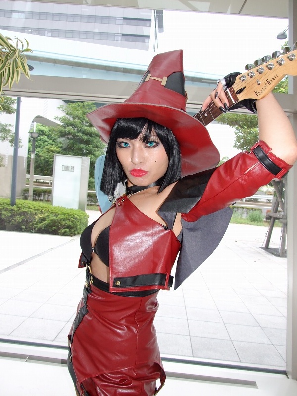minami miki, i-no, arc system works, guilty gear, photo (medium), 1girl, bare shoulders, blue eyes, color contacts, cosplay, cowboy shot, female focus, green eyes, guitar, hat, instrument, looking at viewer, solo, standing, witch hat