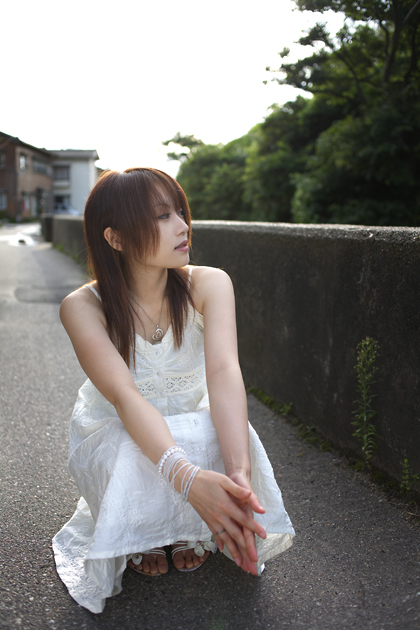 iori, photo (medium), tagme, 1girl, asian, bracelet, brown hair, dress, female focus, full body, jewelry, long hair, looking to the side, necklace, outdoors, ring, sitting, solo, sundress, toes, white dress