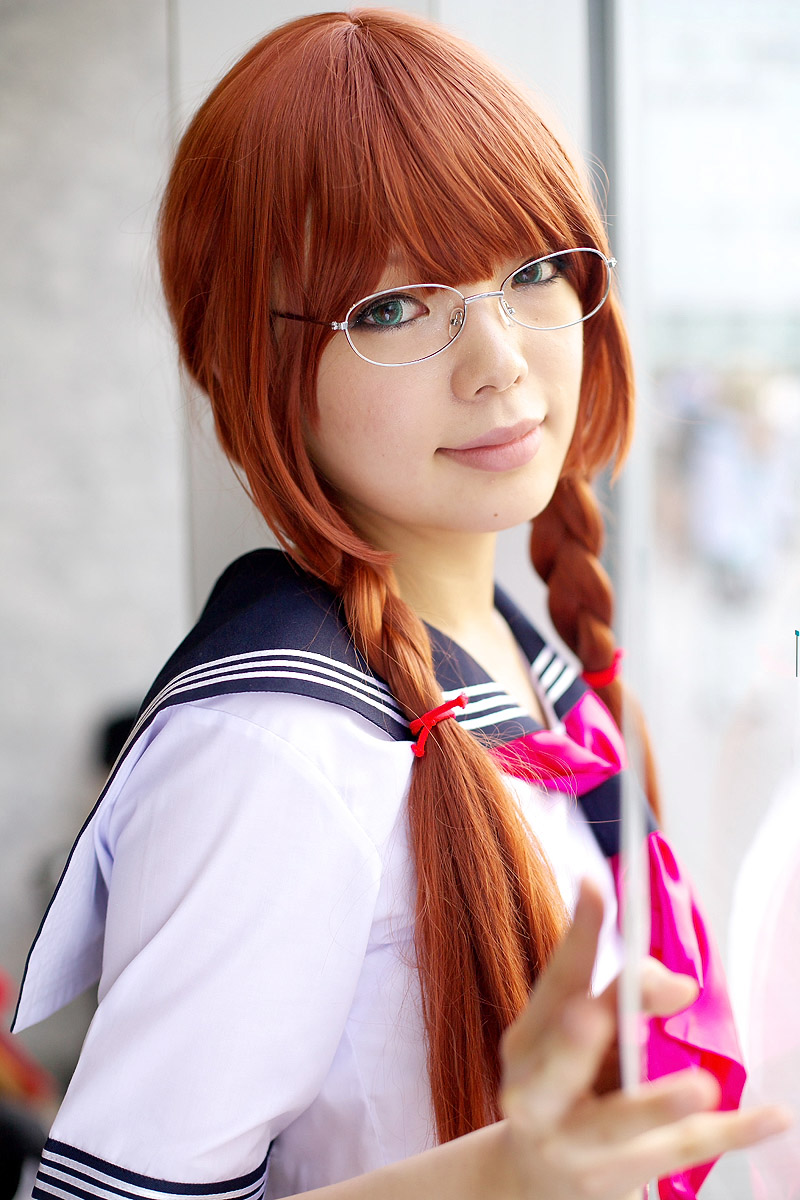 namada, arisugawa shii, the art of yamashita shunya, highres, photo (medium), 1girl, against glass, aqua eyes, arisugawa shii (cosplay), asian, blue eyes, blurry, braid, brown hair, color contacts, cosplay, depth of field, female focus, glasses, green eyes, indoors, lensless glasses, long hair, looking at viewer, sailor, school uniform, serafuku, short sleeves, solo, sword, twin braids, weapon