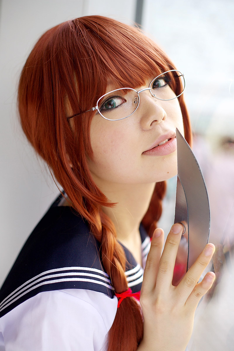 namada, arisugawa shii, the art of yamashita shunya, highres, photo (medium), 1girl, against glass, aqua eyes, arisugawa shii (cosplay), asian, blue eyes, blurry, braid, brown hair, color contacts, cosplay, depth of field, female focus, glasses, green eyes, indoors, lensless glasses, long hair, looking at viewer, sailor, school uniform, serafuku, short sleeves, solo, sword, twin braids, weapon